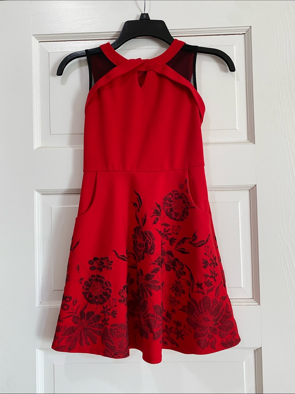 Red sleeveless dress with black accents